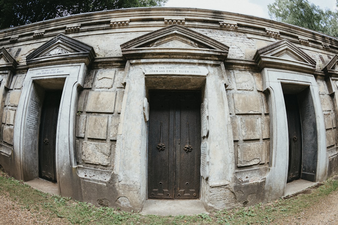 A stone structure with a door and windows,