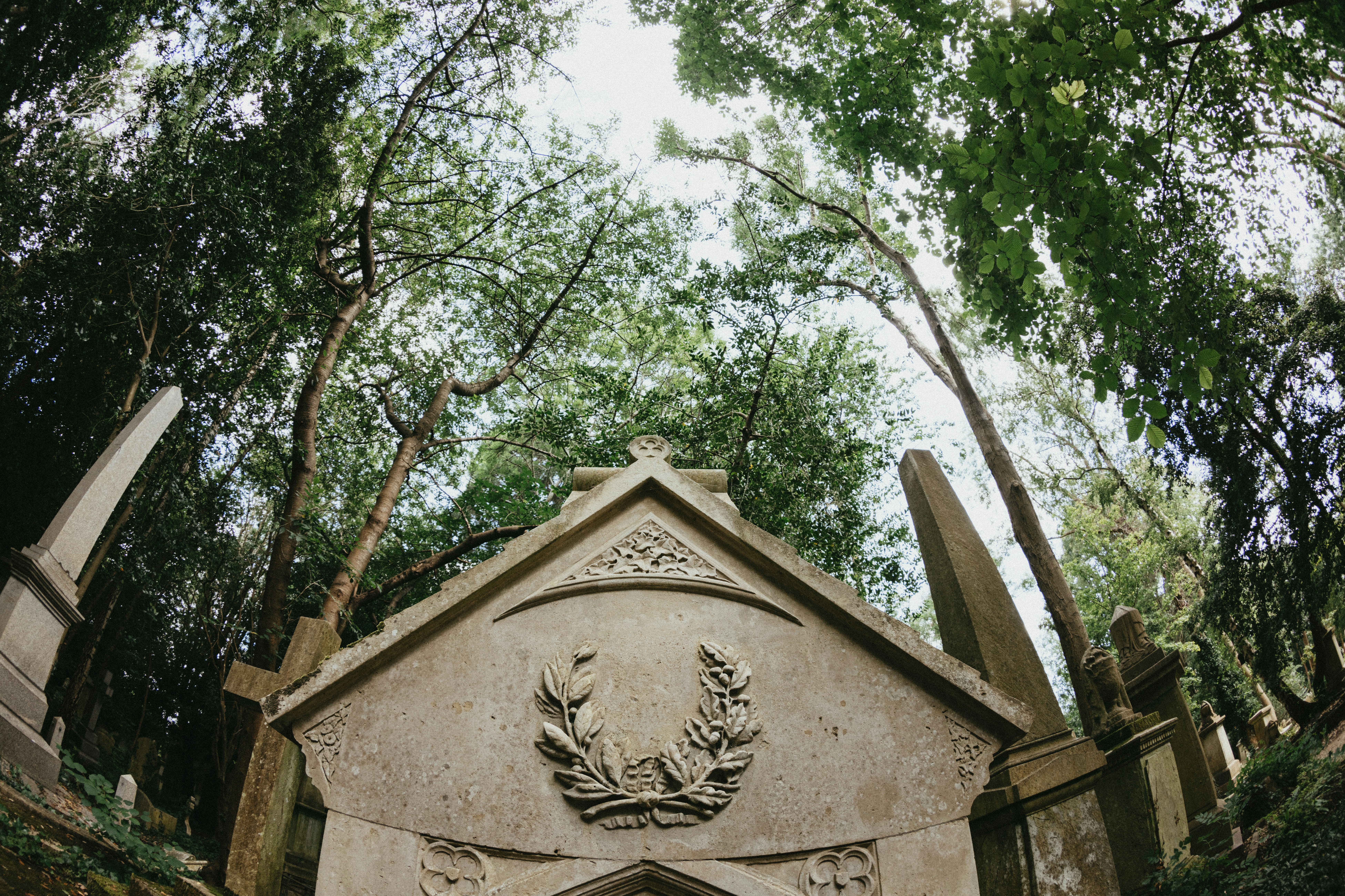 A stone monument with a coat of arms on it