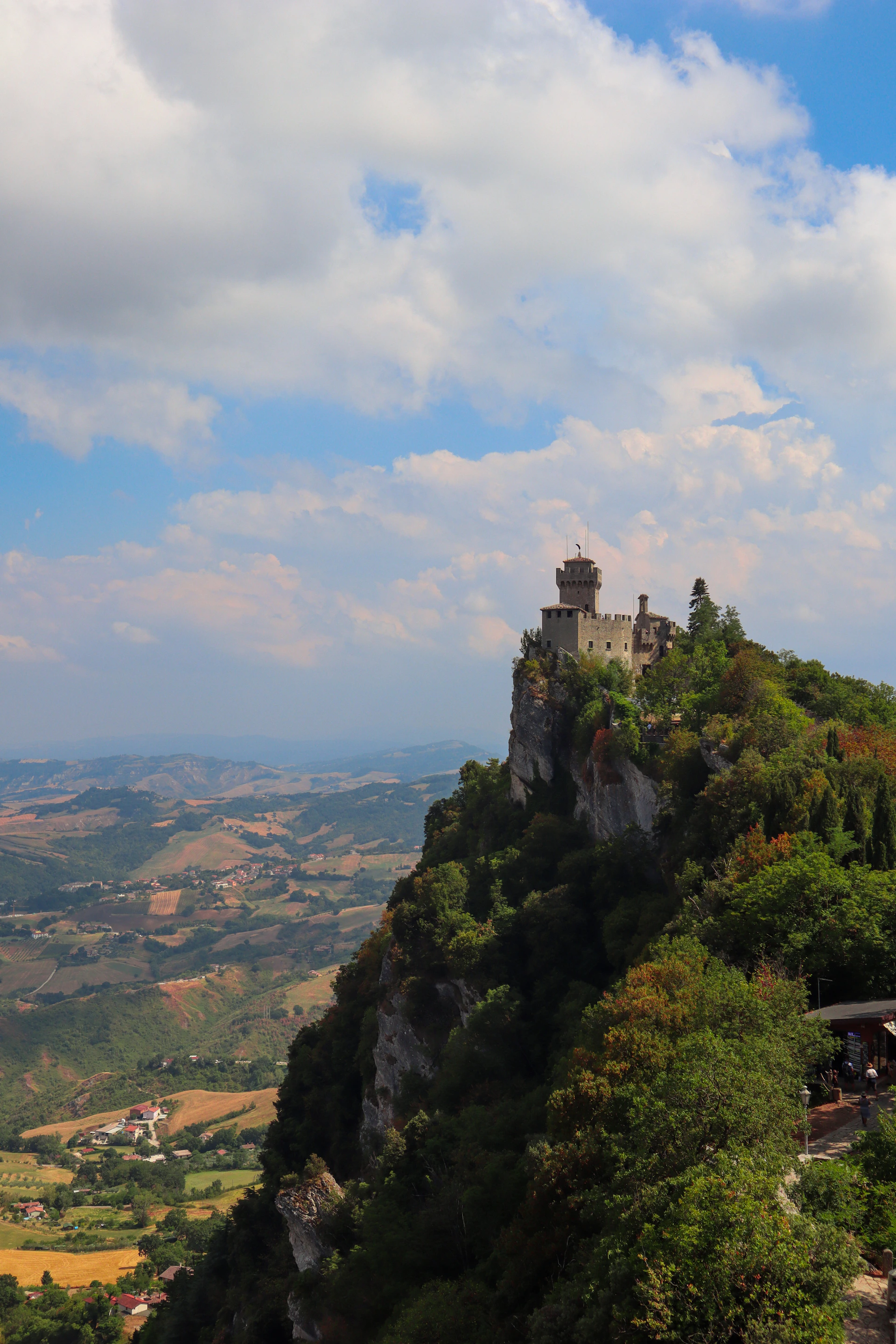 A view of a castle on top of a hill