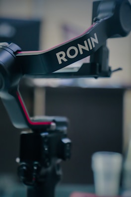 A close up of a camera on a tripod