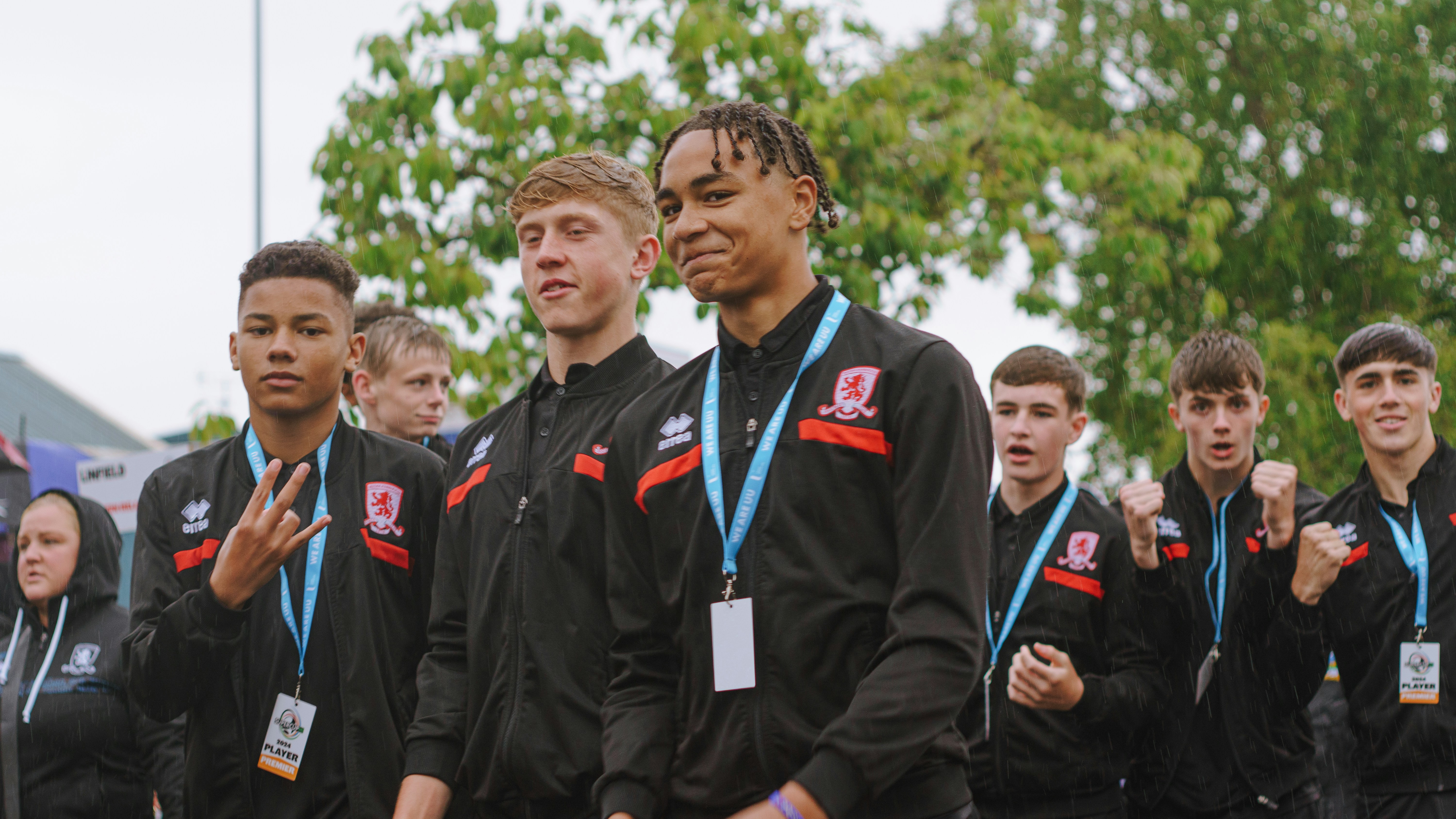 A group of young men standing next to each other