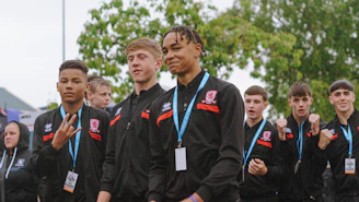 A group of young men standing next to each other