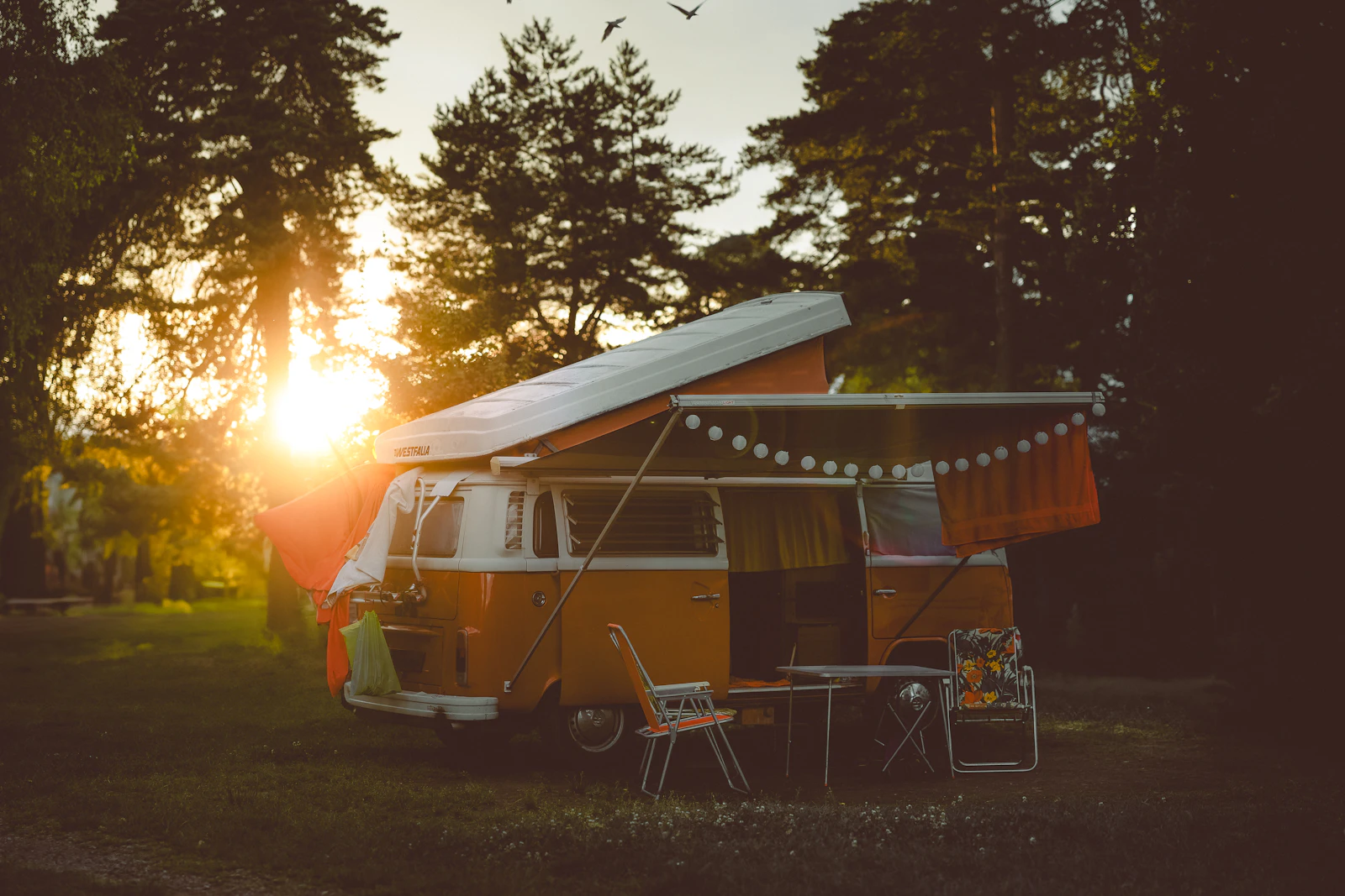 RV parked in a field at golden sunset in North Texas