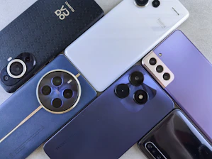A bunch of cell phones sitting next to each other