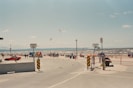 A group of people standing around a parking lot