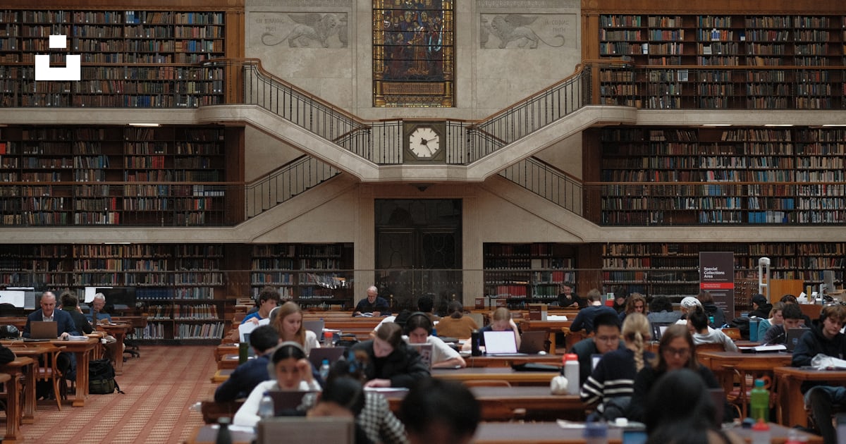 A large library filled with lots of books photo – Free Library Image on ...