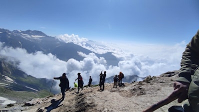 A group of people standing on top of a mountain