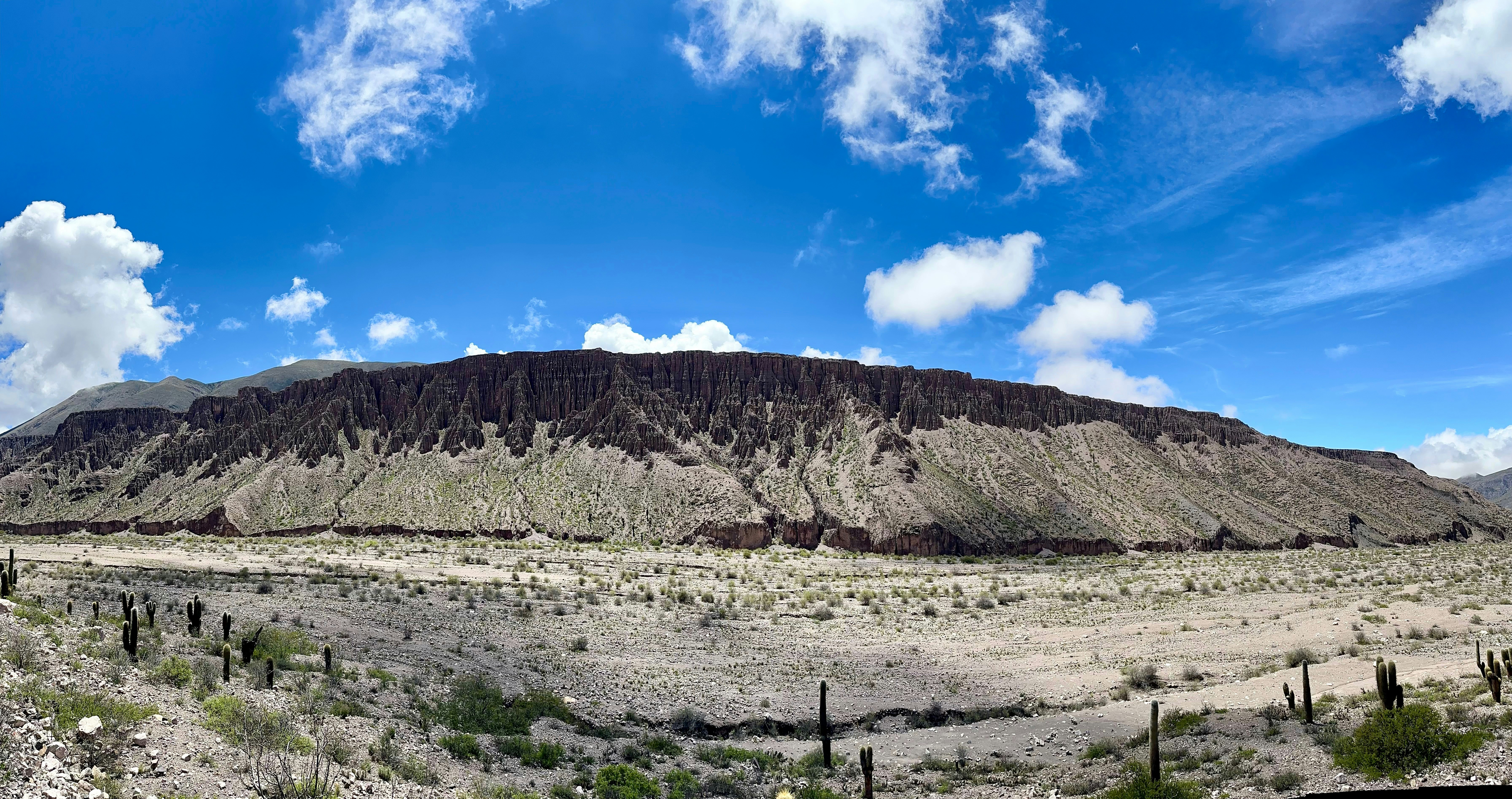A desert landscape with a mountain in the background - Free Photo on ...