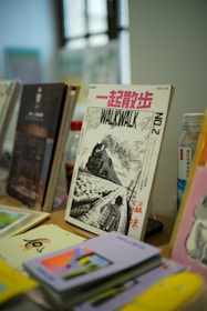 A bunch of books that are on a table