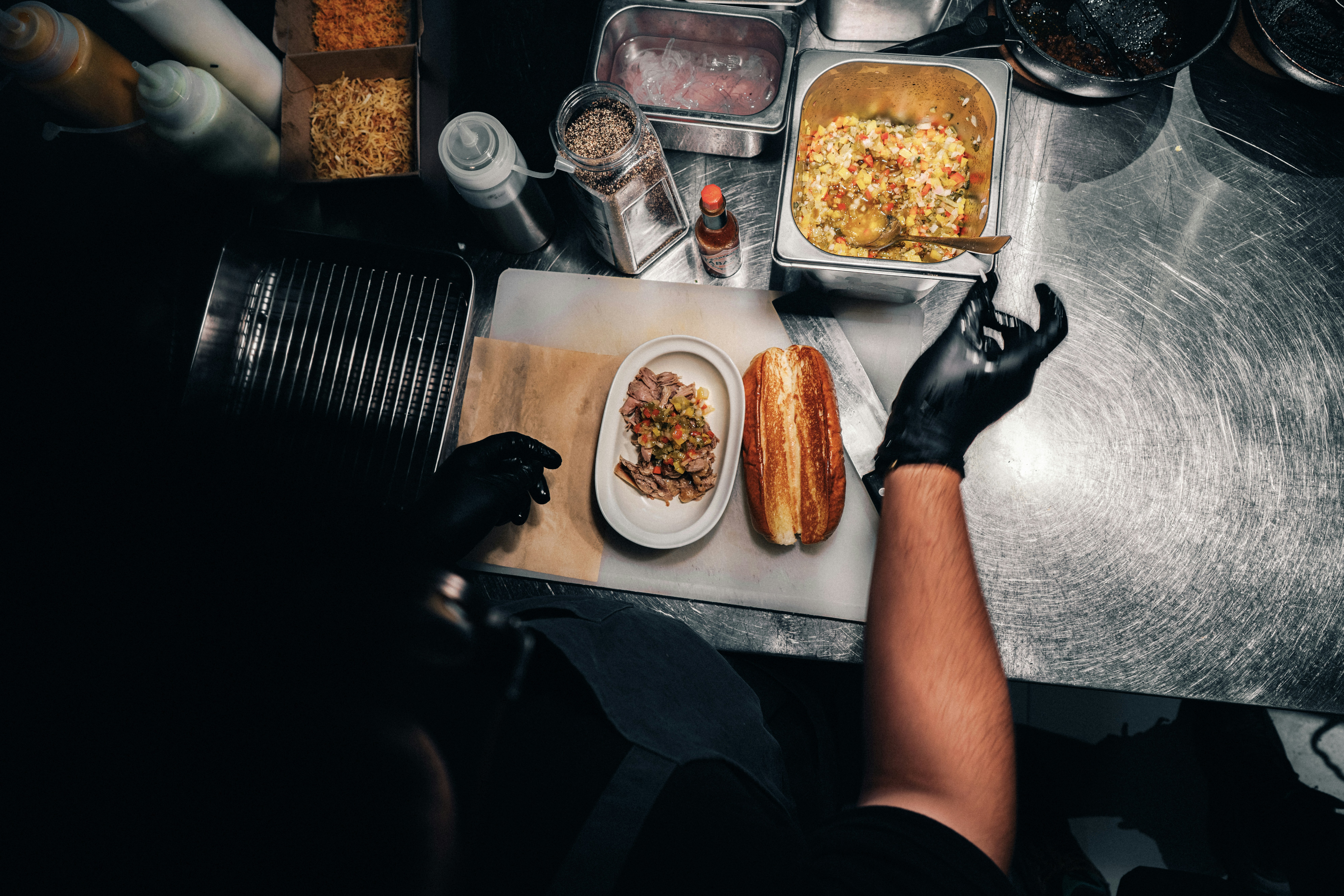 A person sitting at a table with food on it