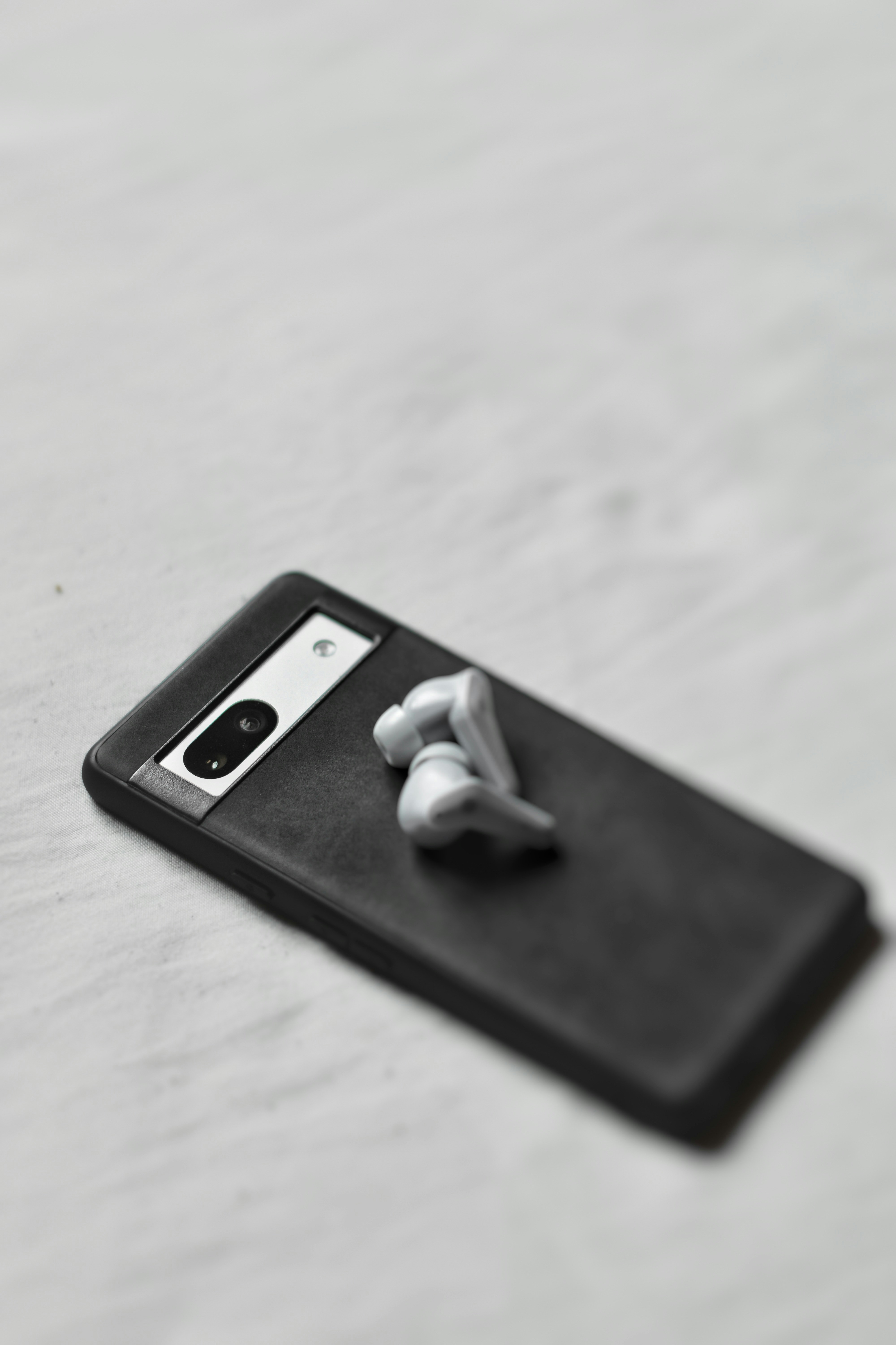 A pair of headphones sitting on top of a black case