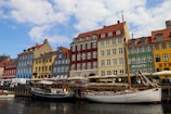 A row of buildings next to a body of water