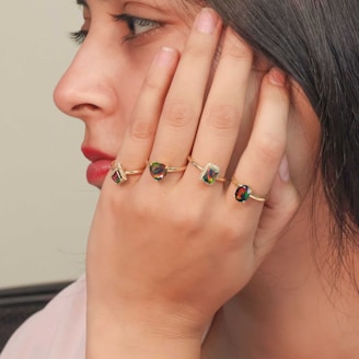 A woman holding her hand up to her face