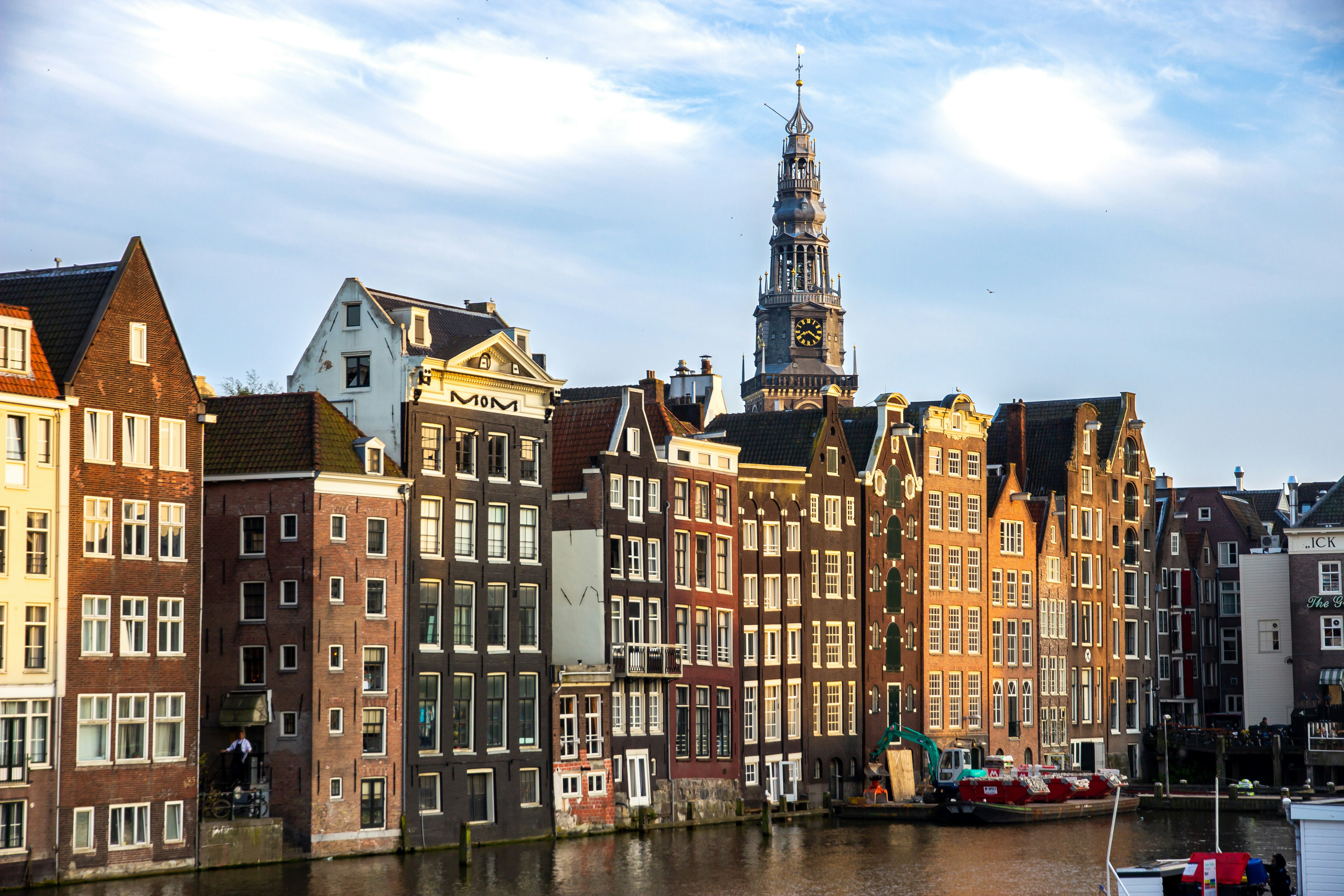 A row of buildings next to a body of water