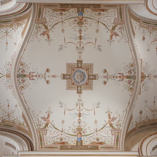 A ceiling with a cross painted on it