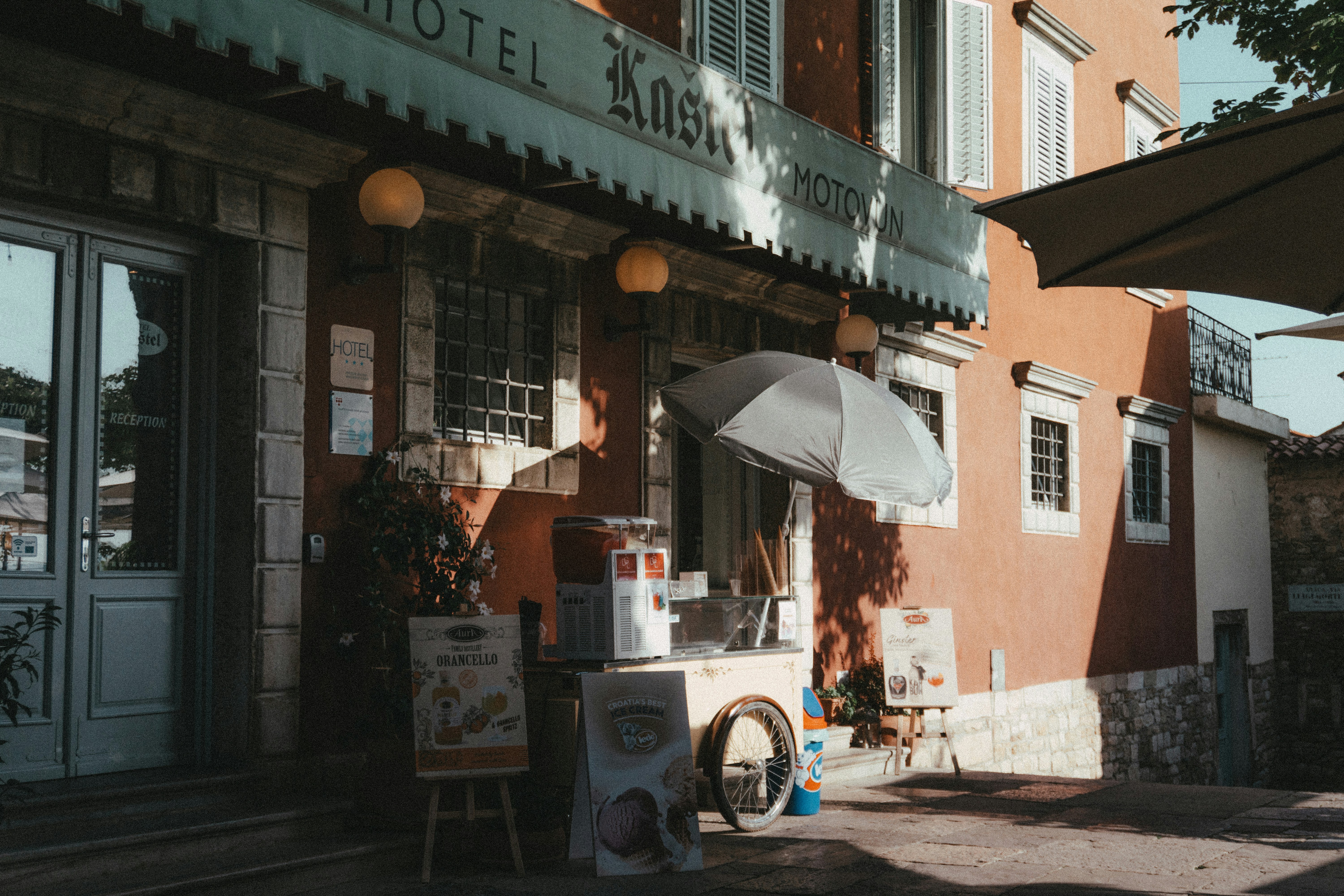 A building with an open umbrella outside of it
