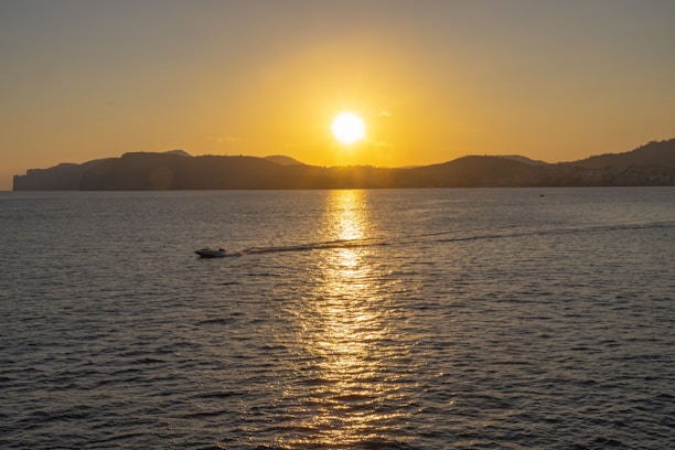 The sun is setting over a body of water