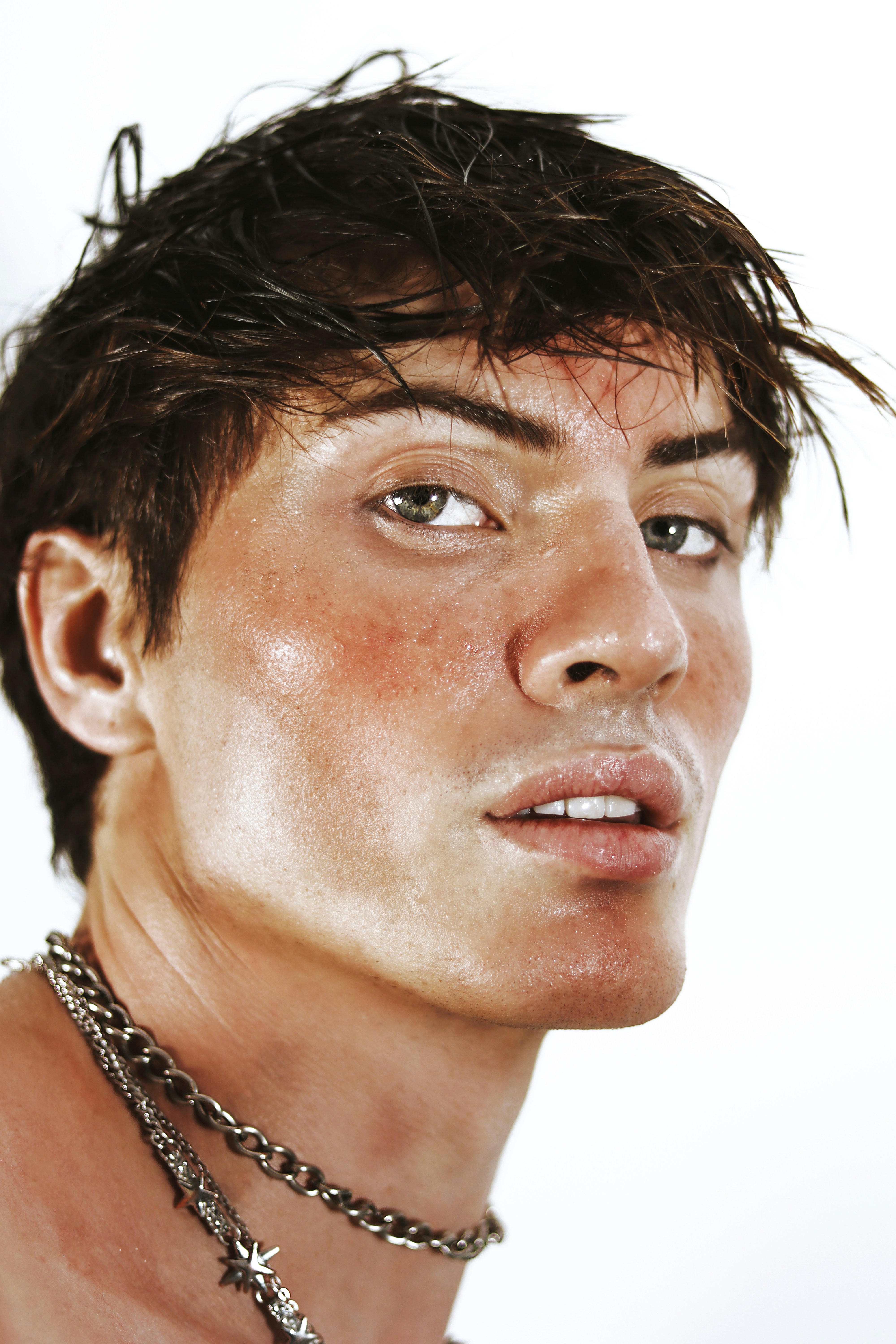 A close up of a person wearing a necklace