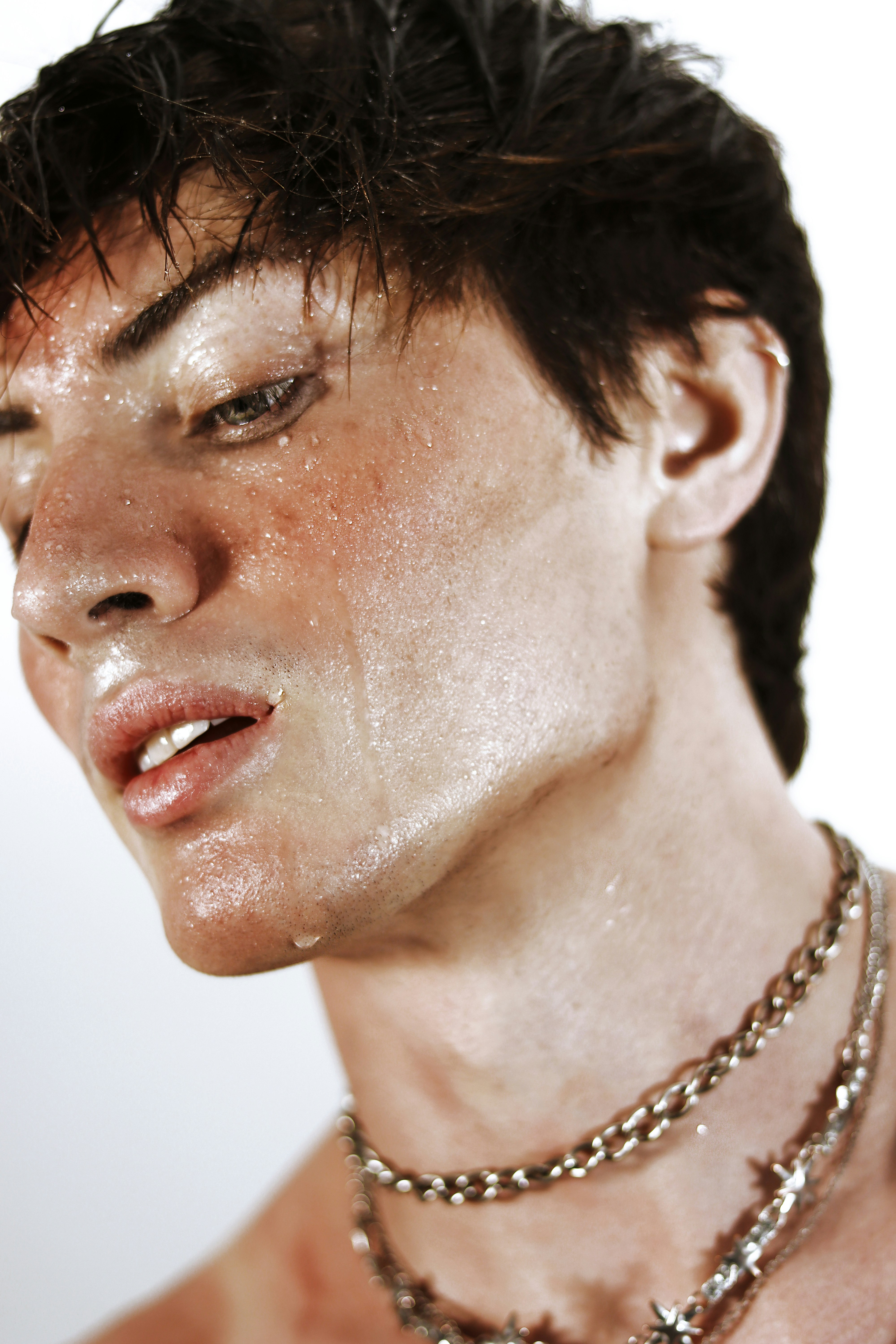 A close up of a person wearing a necklace