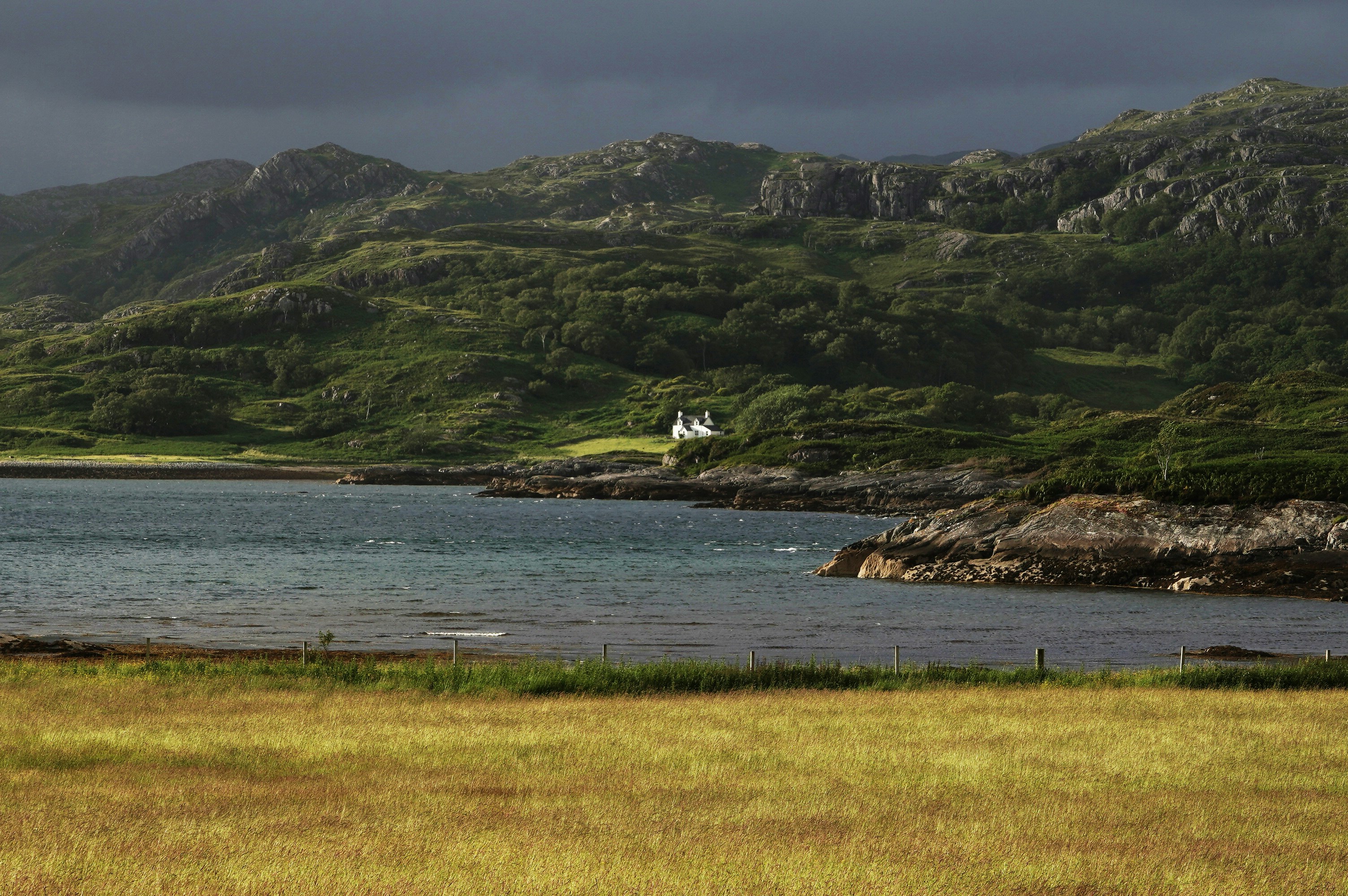 A large body of water surrounded by mountains