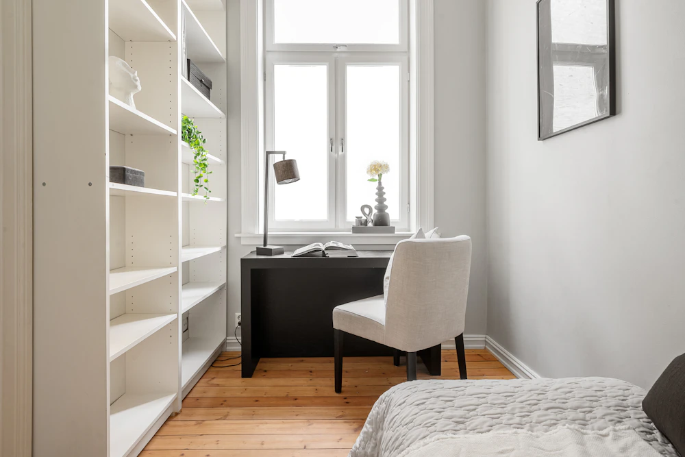 Bedroom with functional desk chair and bookcase