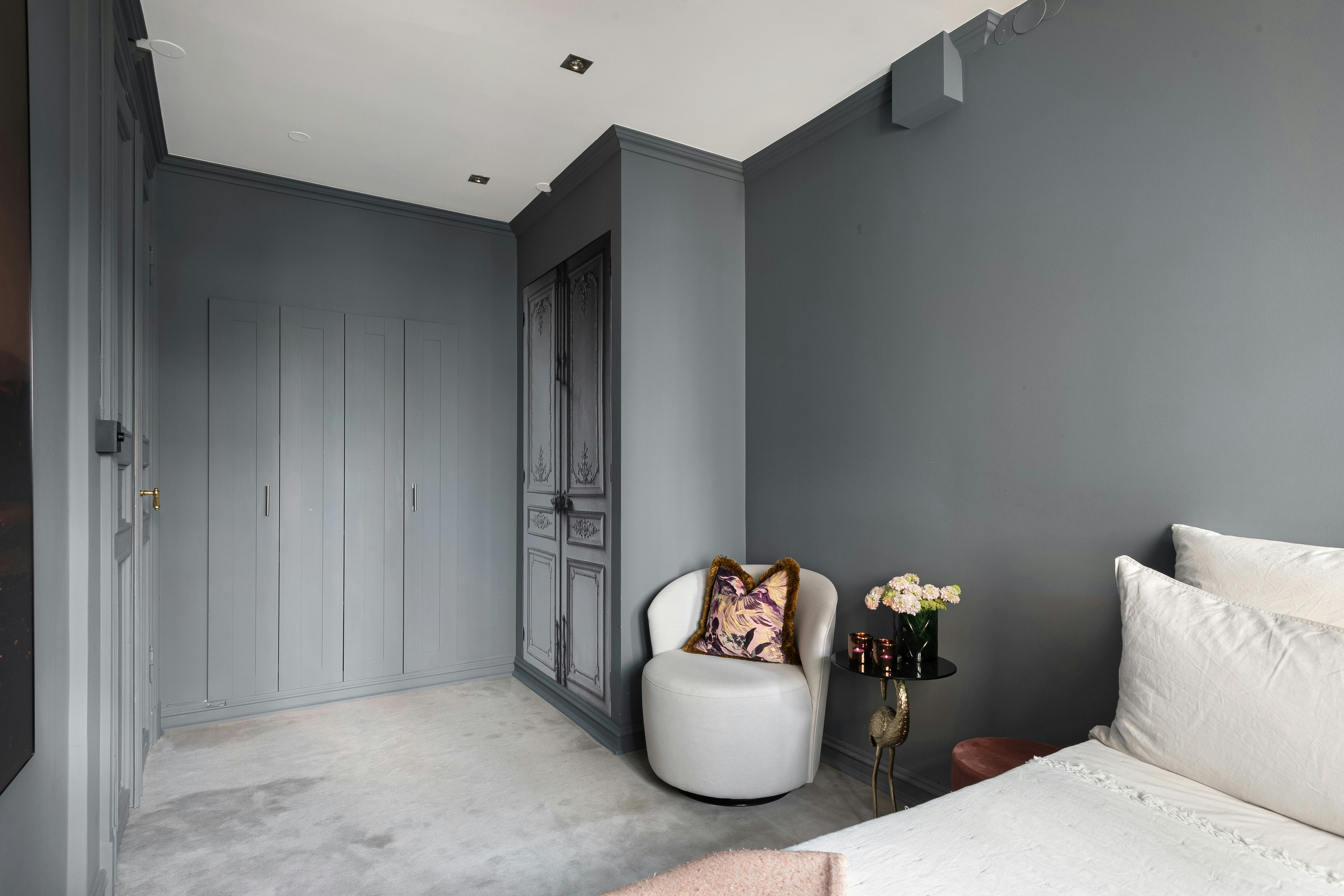 modern bedroom with an exposed concrete accent wall - modern apartment living