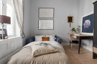 A bedroom with a bed and a desk