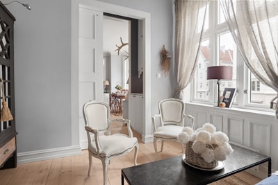 A living room filled with furniture and a large window