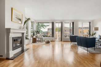 A living room filled with furniture and a fire place