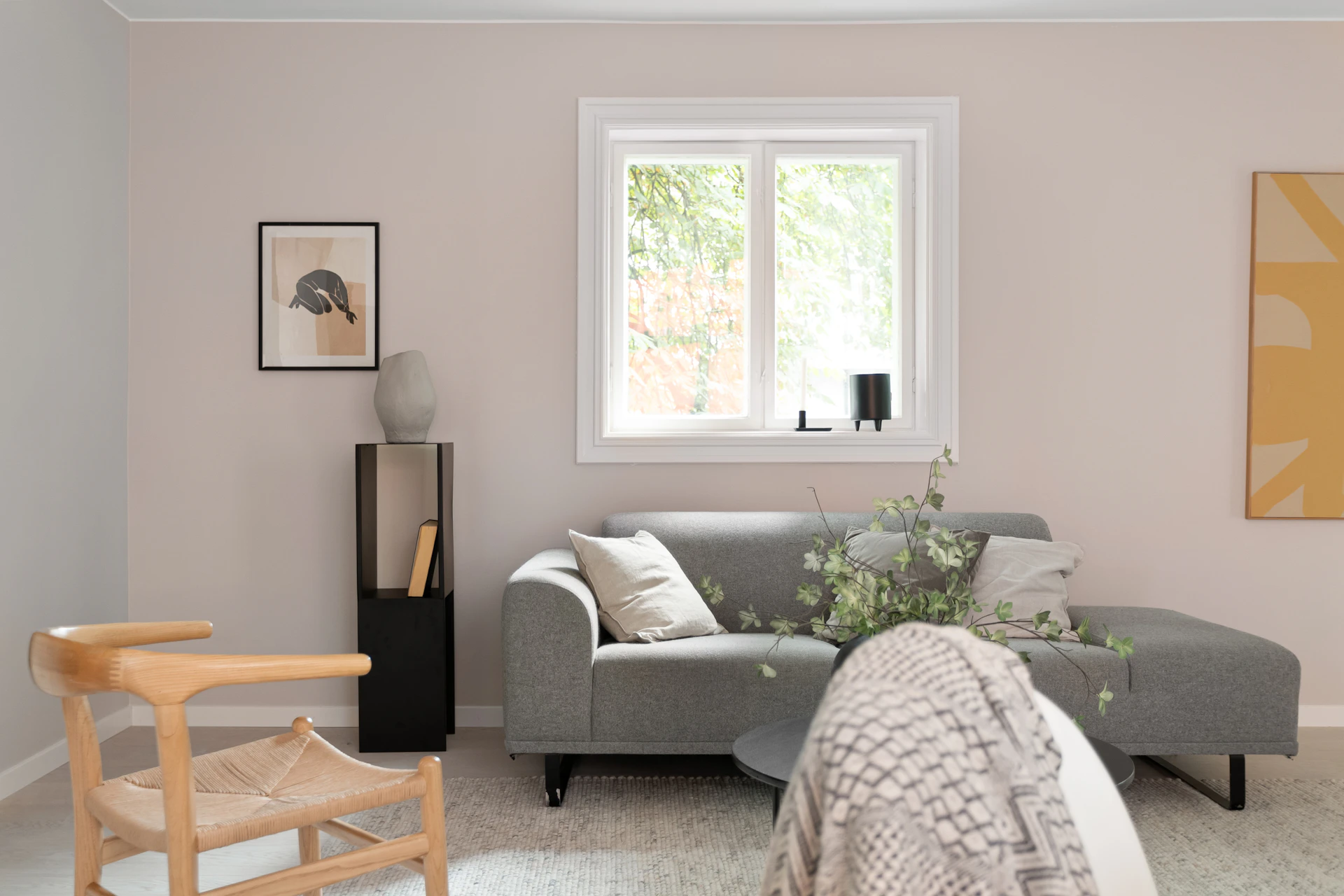 A living room filled with furniture and a window