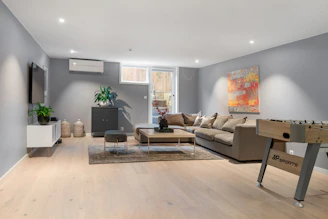 A living room filled with furniture and a flat screen TV