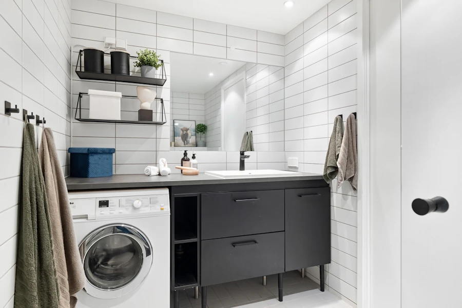 Tall storage cabinet with balcony laundry base cabinet