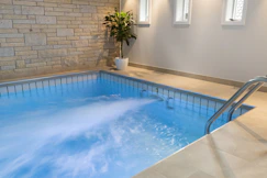 A large indoor swimming pool in a house