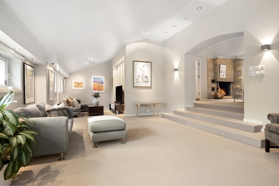 A living room filled with furniture and a fire place