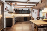 A large kitchen with a wooden table in it