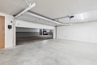 An empty parking garage with a door open
