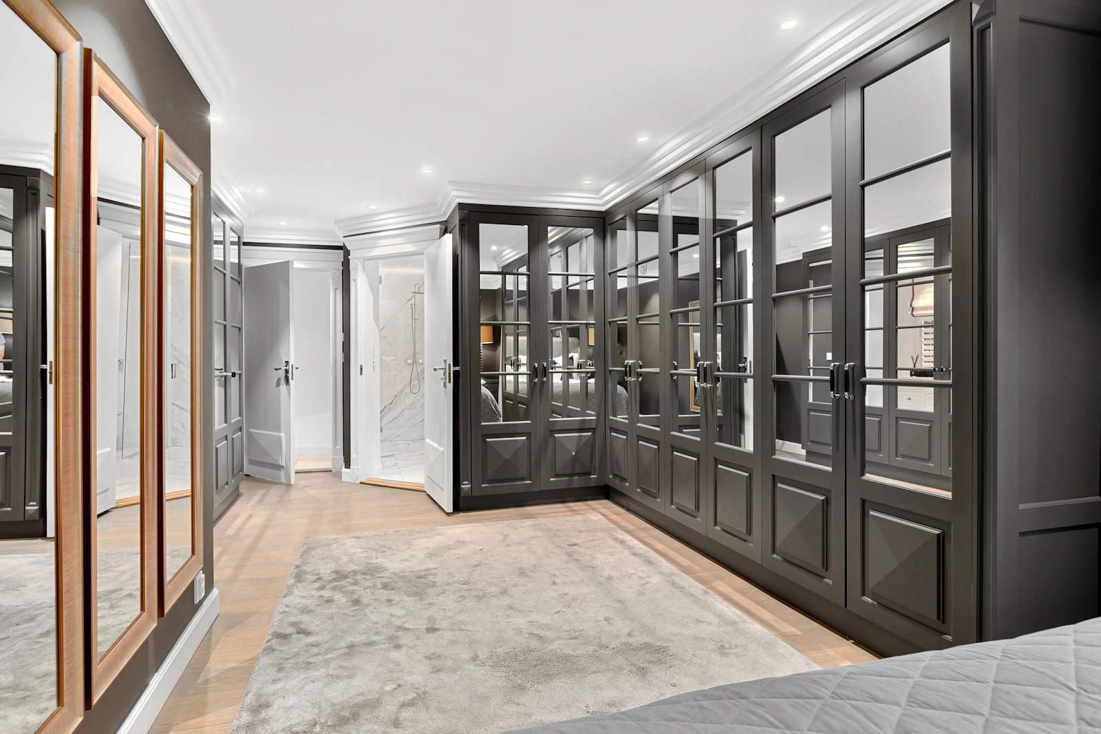 Framed glass and mirrored wardrobe doors along a dressing room wall, similar to closet doors installed in Glendora and La Verne California homes