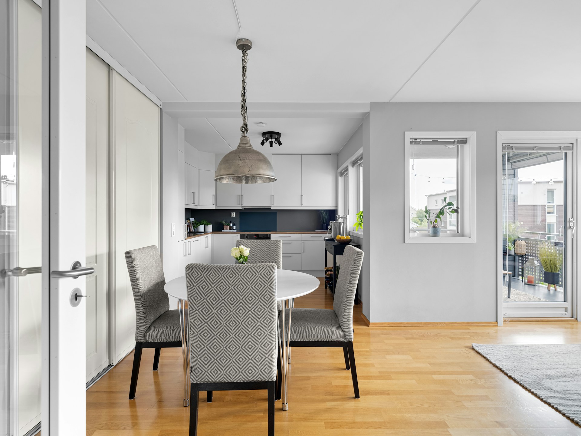 A dining room table and chairs in a room