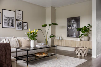 A living room filled with furniture and pictures on the wall