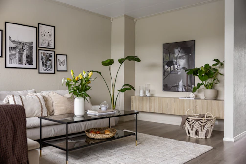 A living room filled with furniture and pictures on the wall