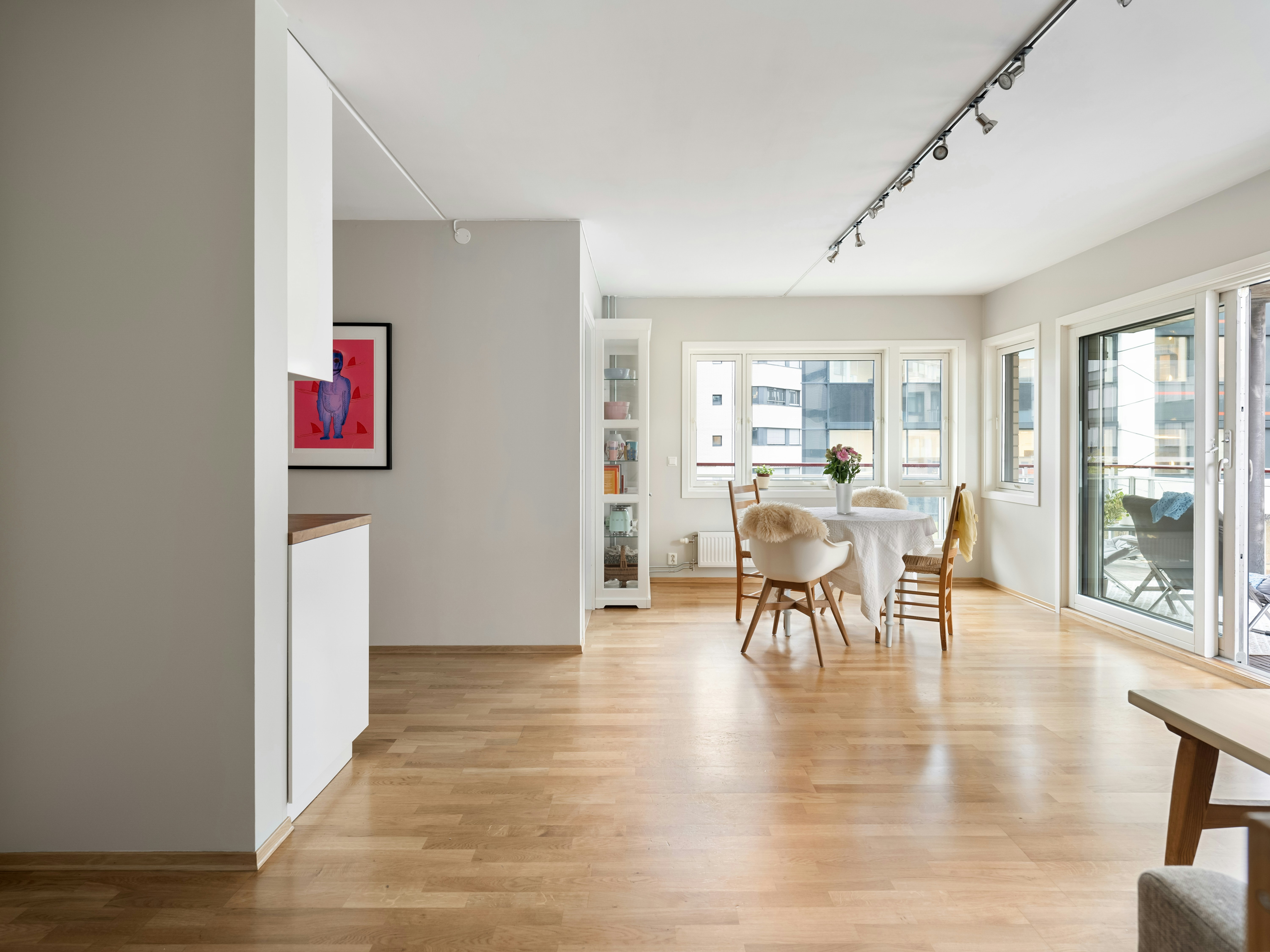 A living room filled with furniture and lots of windows