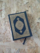 A blue book sitting on top of a wooden floor