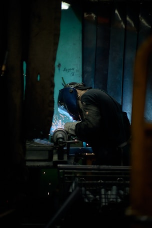 A man working on a piece of metal