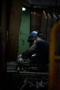 A man working on a machine in a factory
