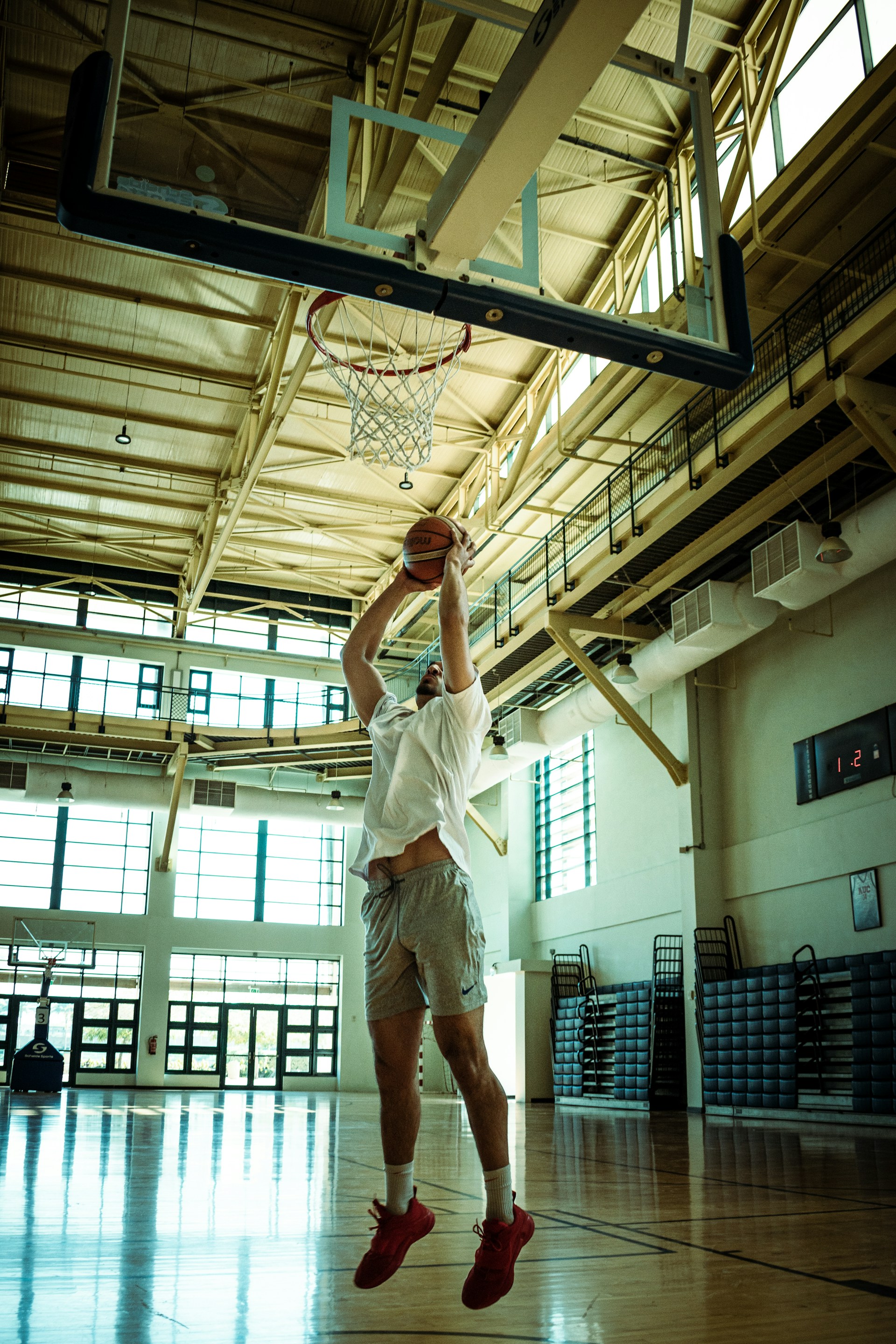 A basketball player jumping up to dunk a basketball