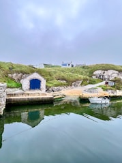 A body of water with a boat in it ballintoy 