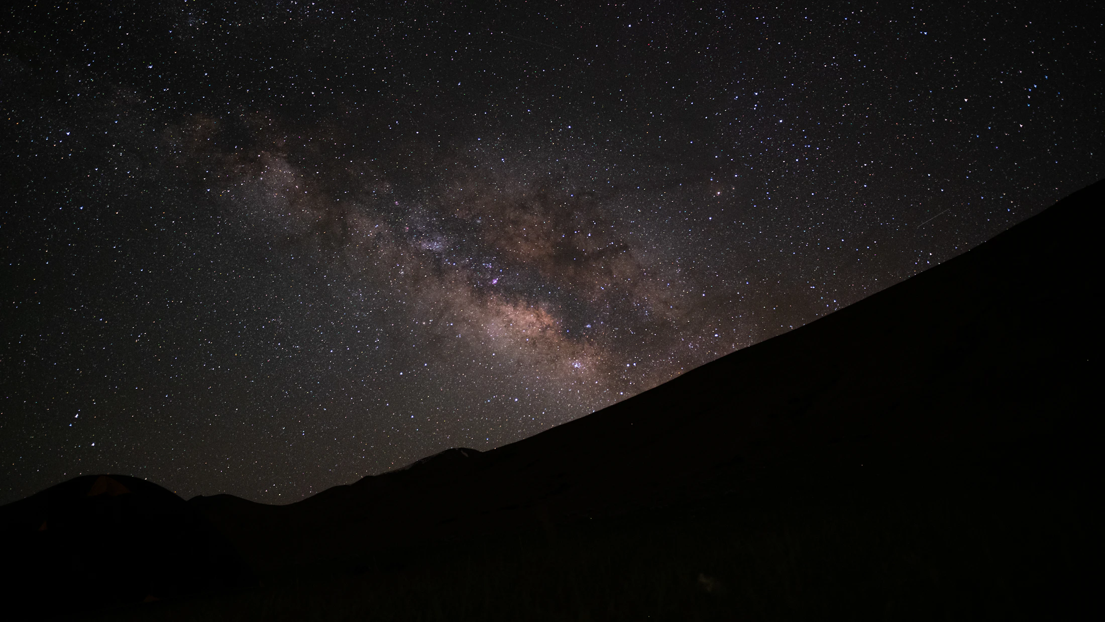 The core of the Milky Way over a dark Ladakhi ridge on a new-moon night