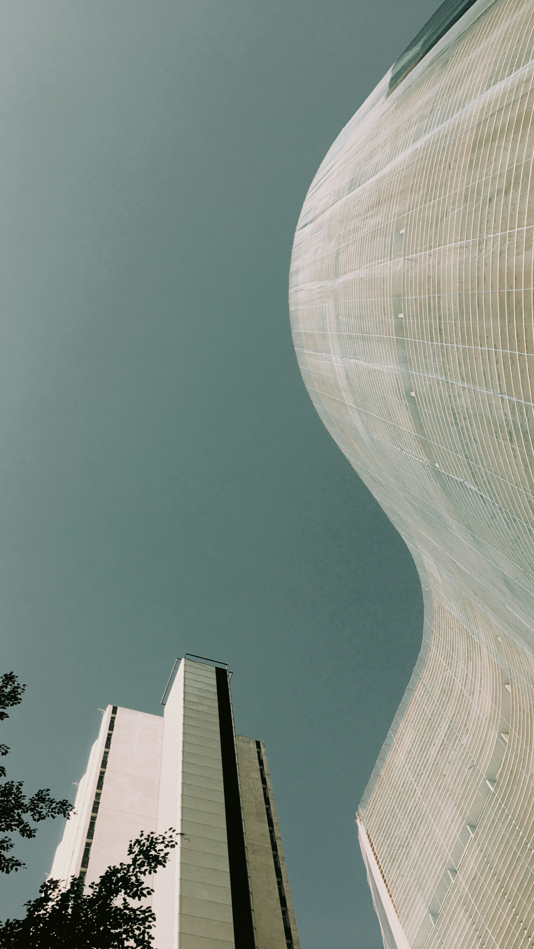 A couple of tall buildings sitting next to each other