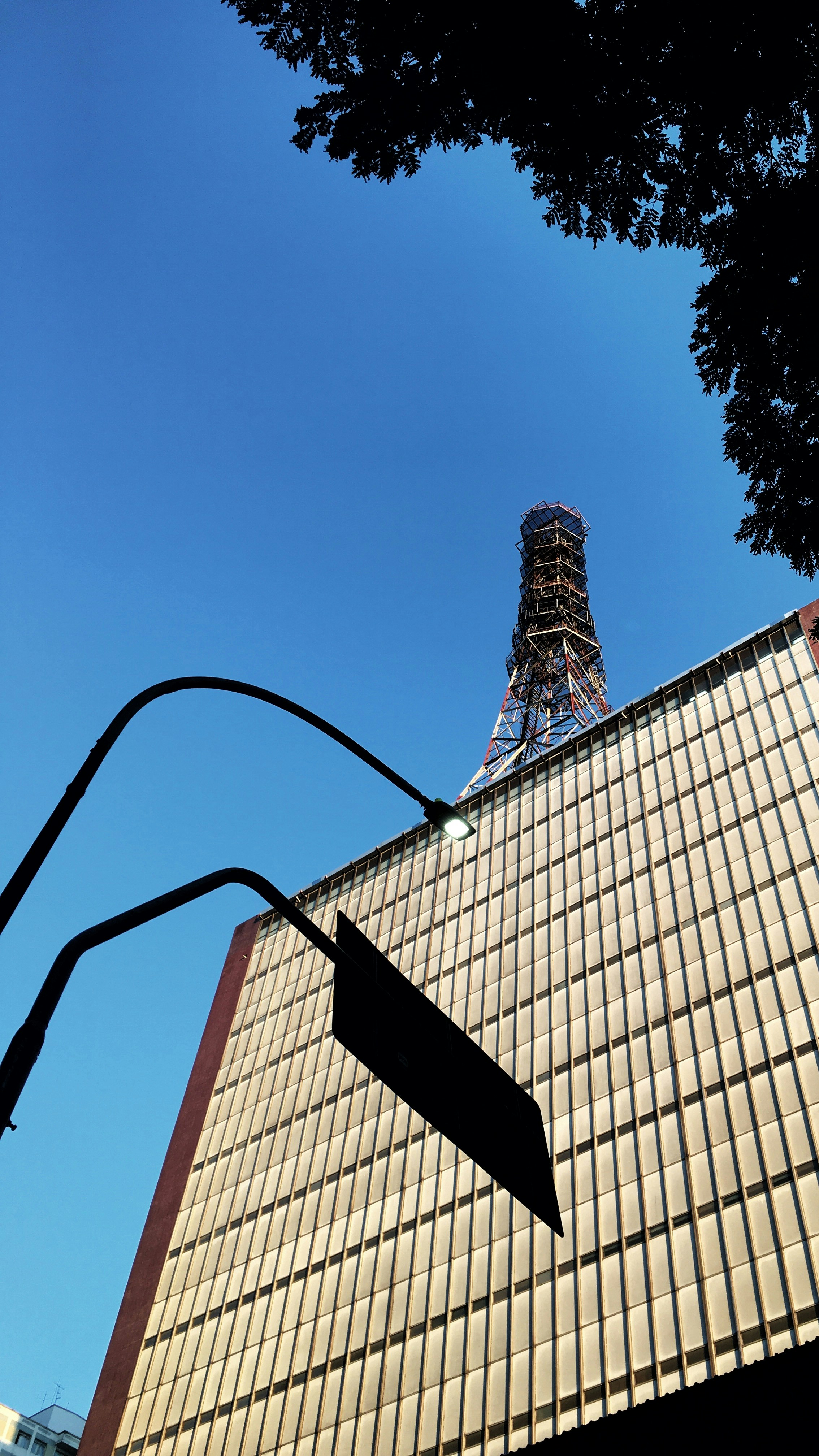 A tall building sitting next to a traffic light