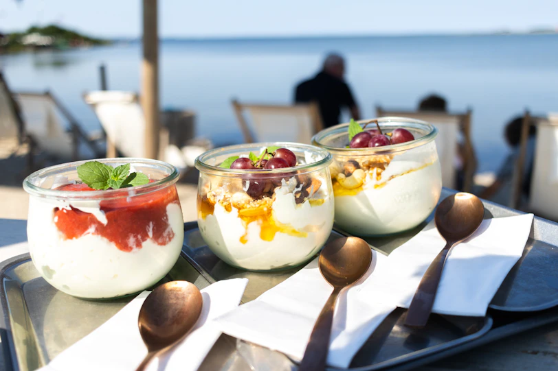 A table topped with desserts on top of a metal tray